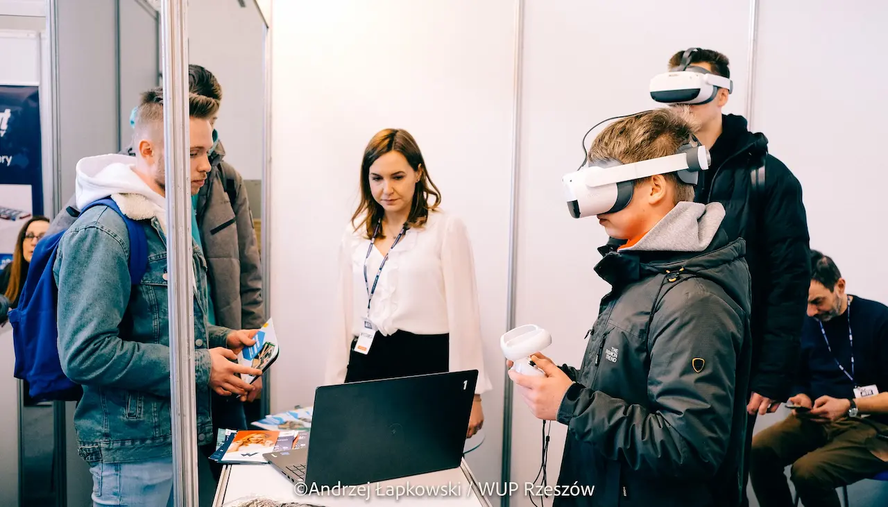 A teenager tries the VR programme in a headset while a careers counsellor looks on